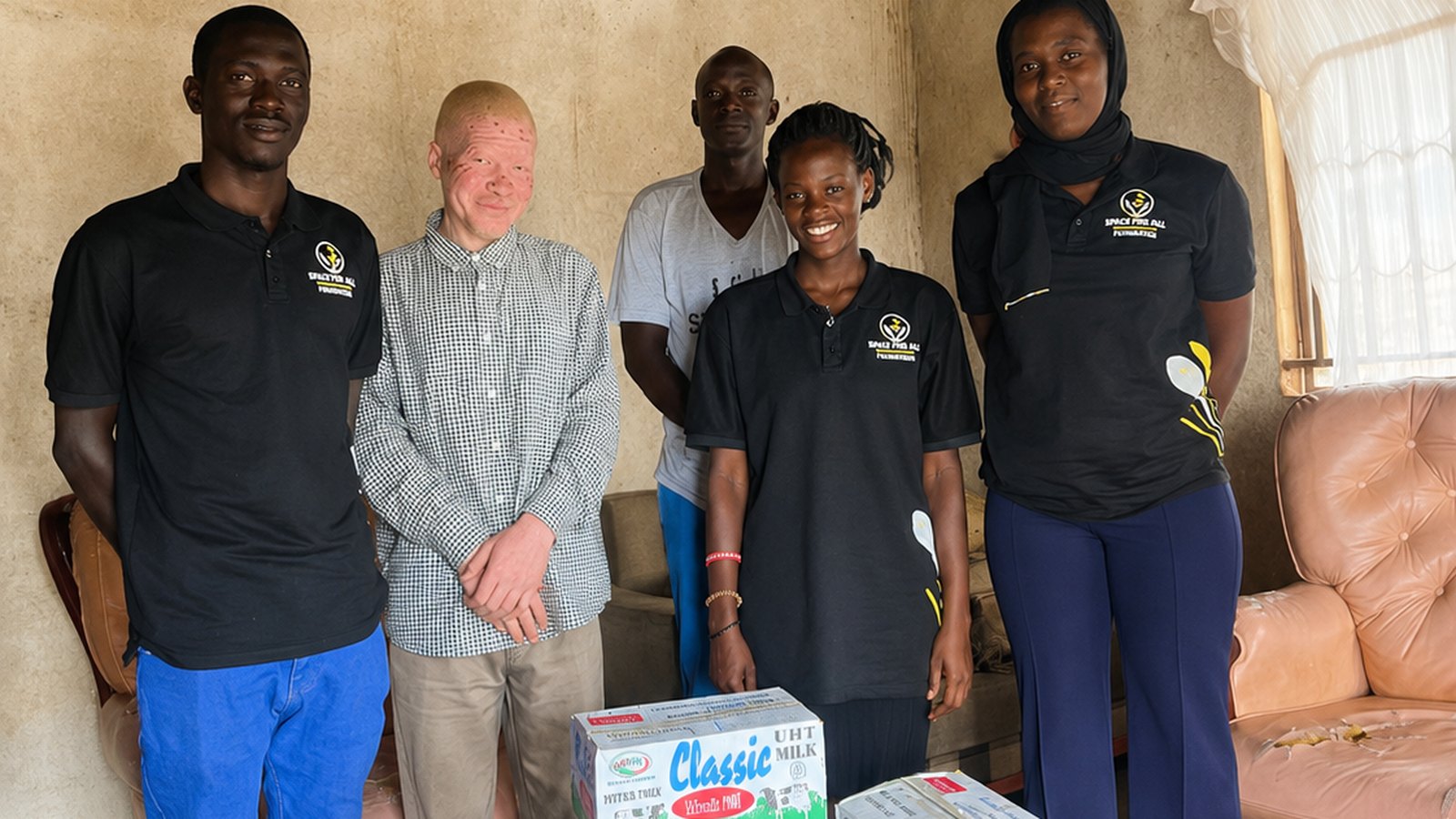 Space For All Foundation team members visiting Jude Kiwanuka's home in Kyebando Nsooba and delivering temporary nutritional support.